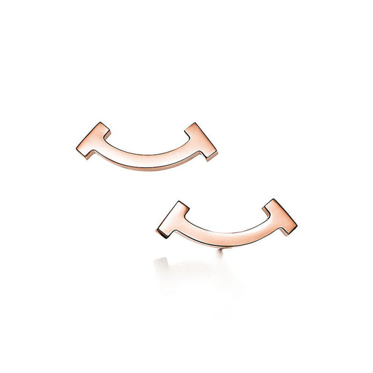 Boucles d'oreilles T Smile en 18 carats