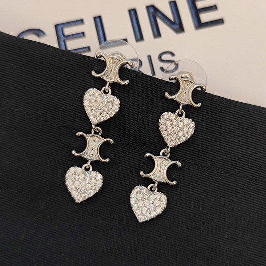 Boucles d'oreilles pendantes coeur Triomphe 18 carats