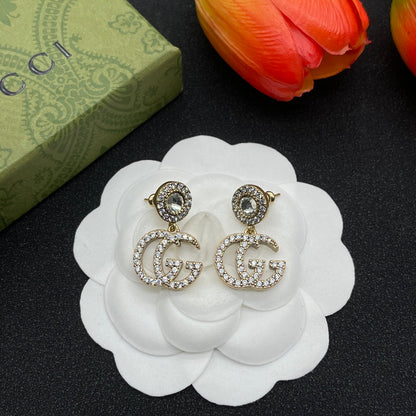 Boucles d'oreilles avec cristaux Double G 18 carats