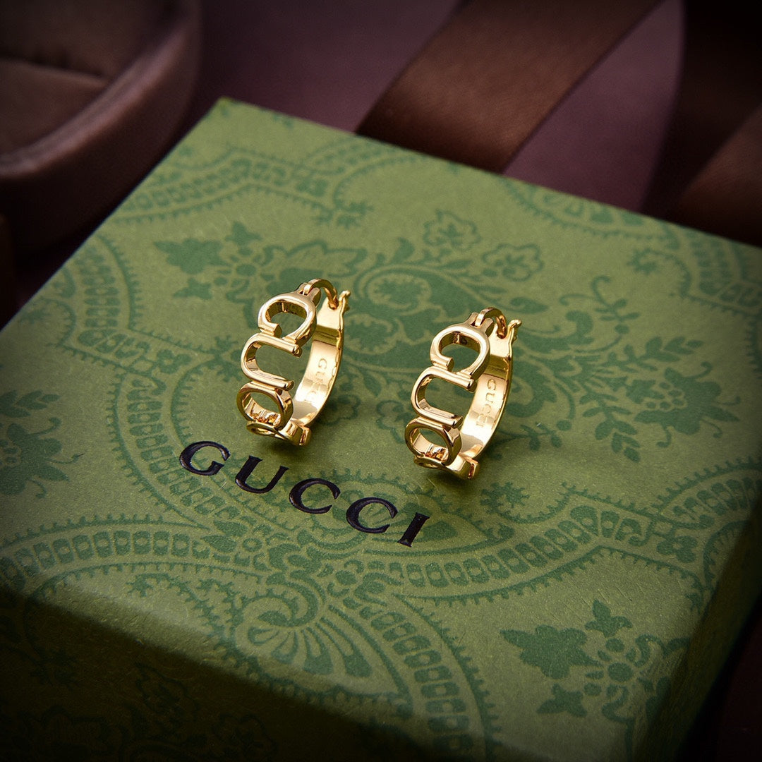 Boucles d'oreilles double G en 18 carats