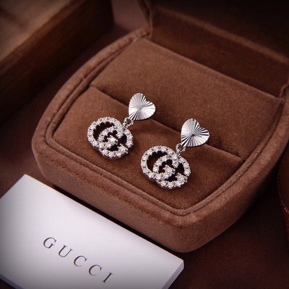 Boucles d'oreilles de course Double G 18 carats