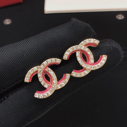 Boucles d'oreilles en cristaux de résine rose CC 18 carats