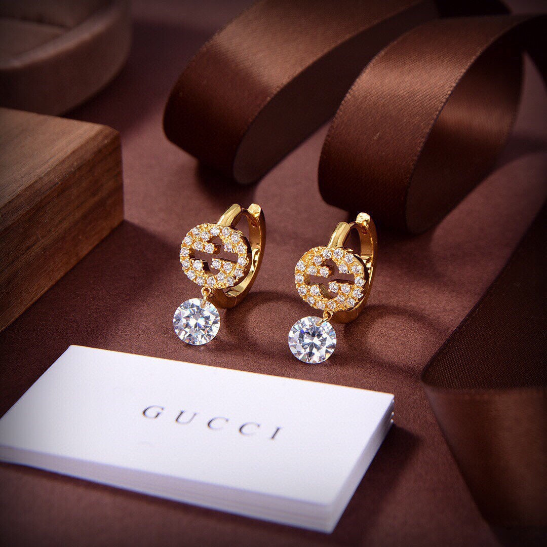 Boucles d'oreilles à diamants G entrelacés Double G 18 carats