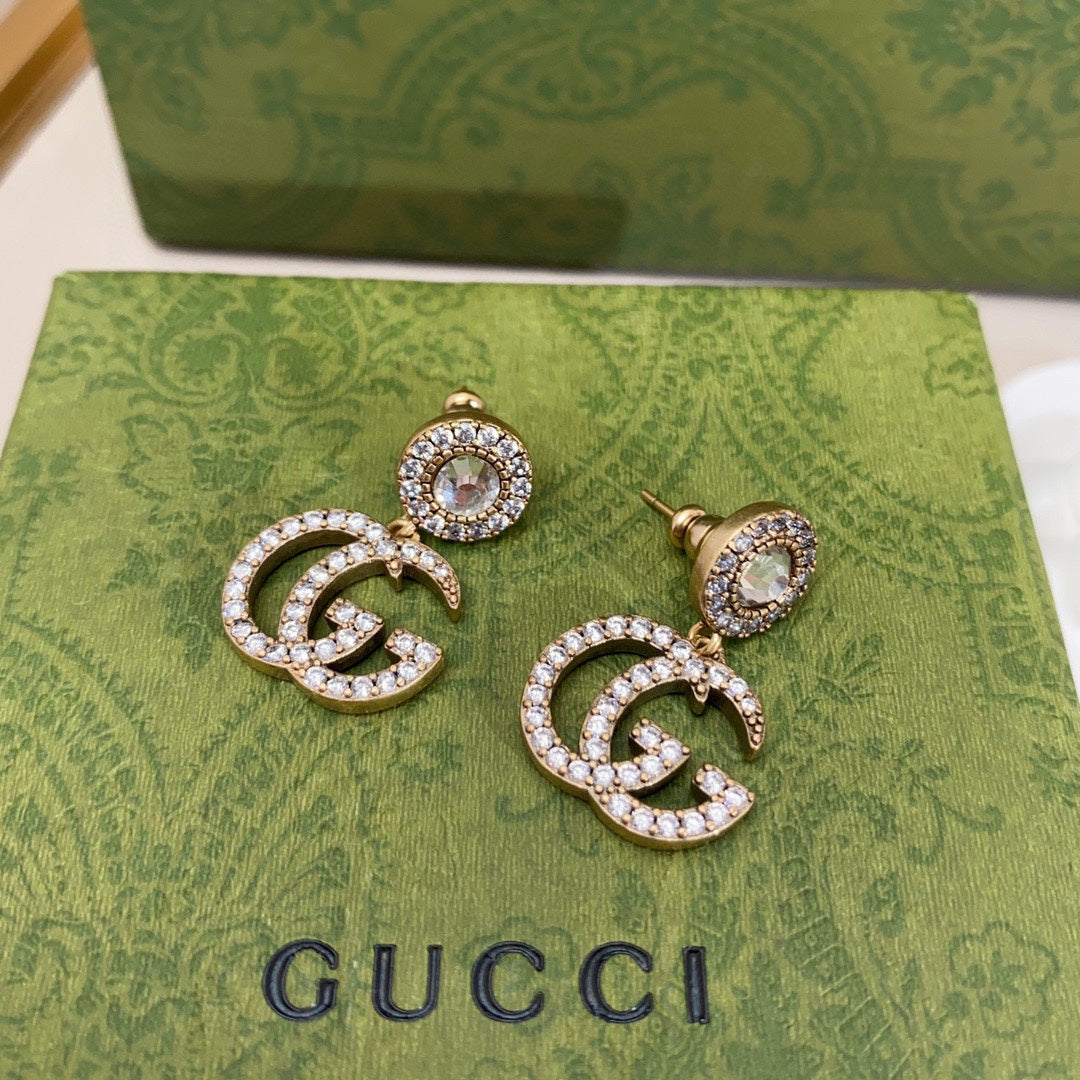 Boucles d'oreilles pendantes en cristal Double G 18 carats