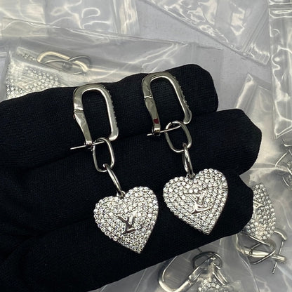 Boucles d'oreilles coeur en diamant Louis 18 carats