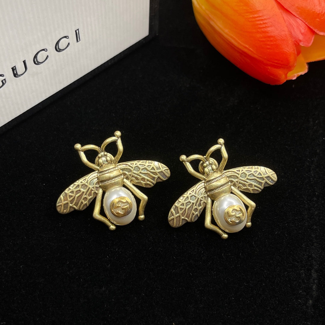 Boucles d'oreilles en perles d'abeille Double G 18 carats