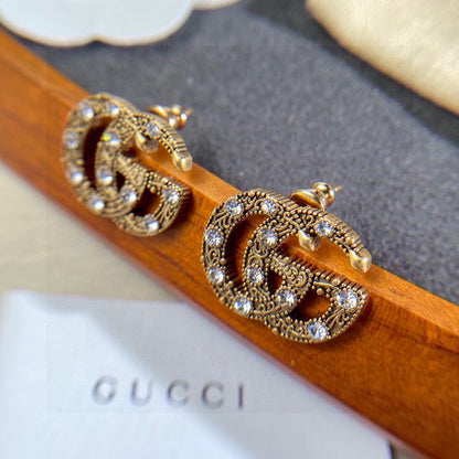 Boucles d'oreilles avec cristaux Double G 18 carats