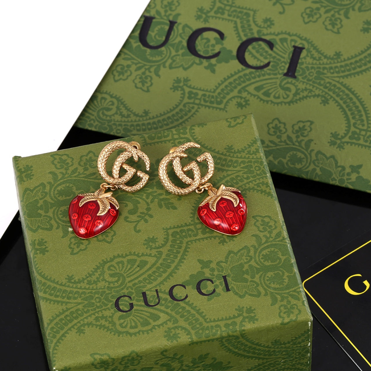 Boucles d'oreilles fraise Double G 18 carats