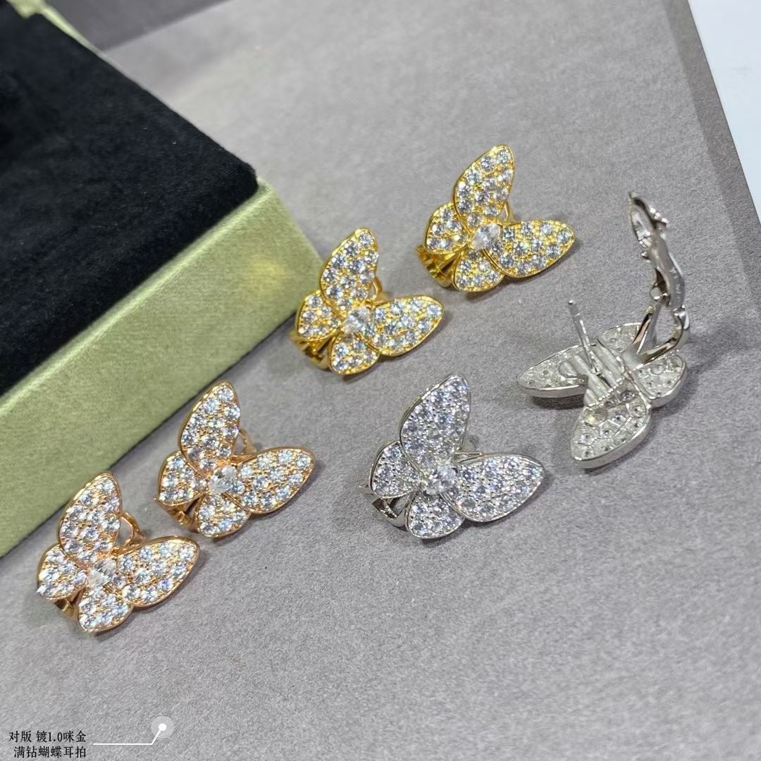 Boucles d'oreilles deux diamants papillon 18 carats