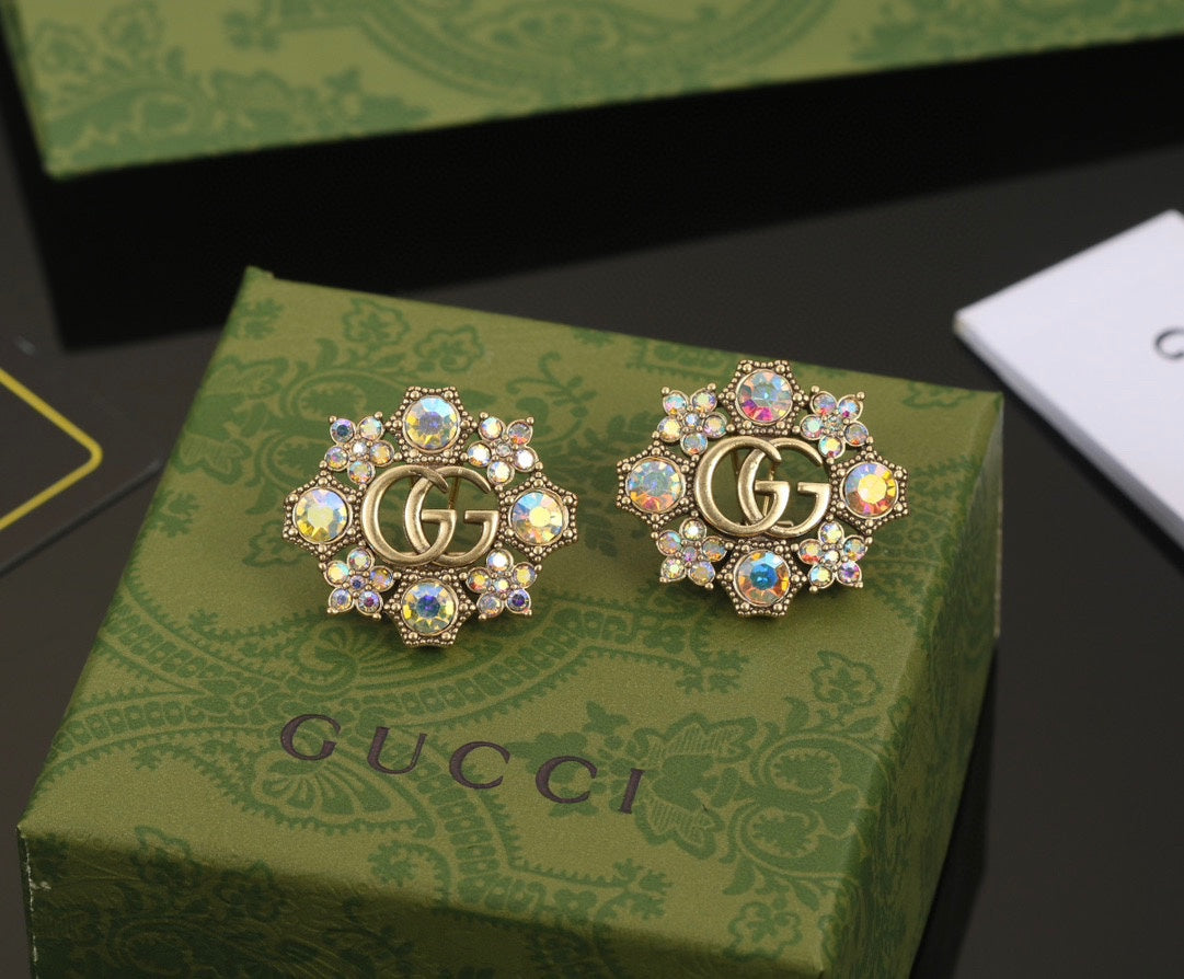 Boucles d'oreilles fleurs bleues Double G 18 carats