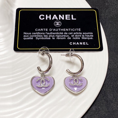 Boucles d'oreilles coeur violet 18 carats CC