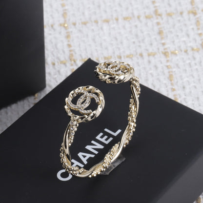 Bracelet ouvert double CC 18 carats