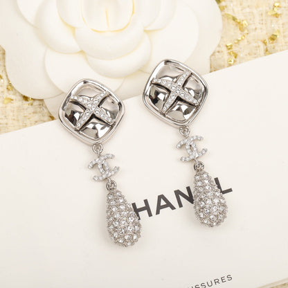 Boucles d'oreilles losange croix CC 18 carats