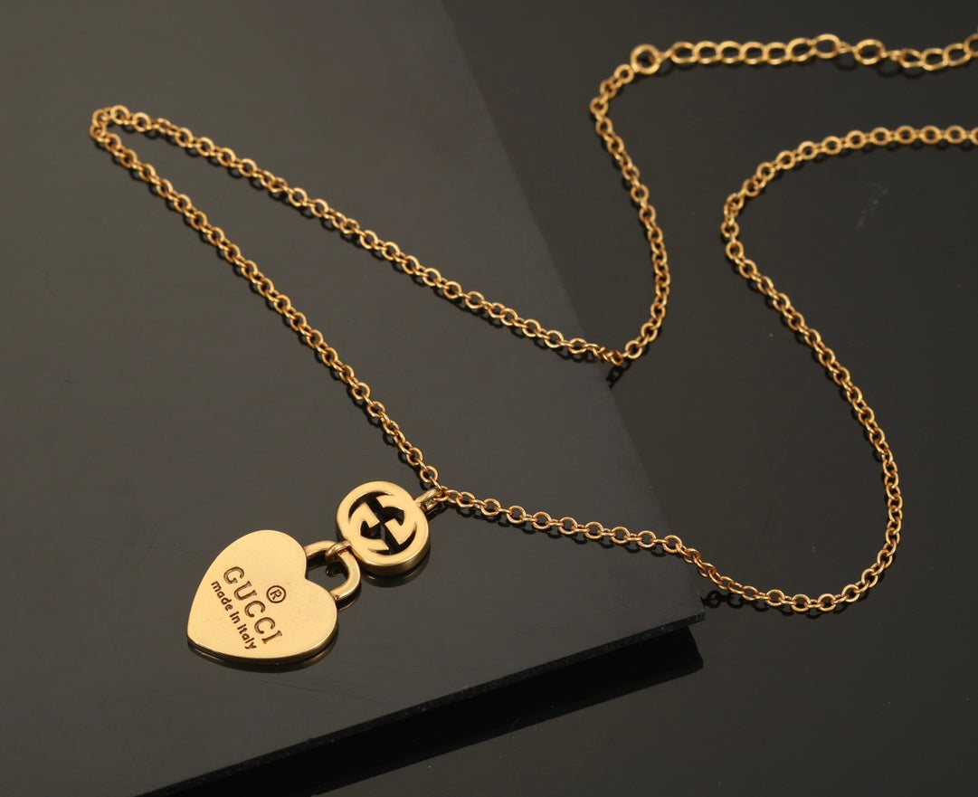 Collier pendentif cœur double G 18 carats