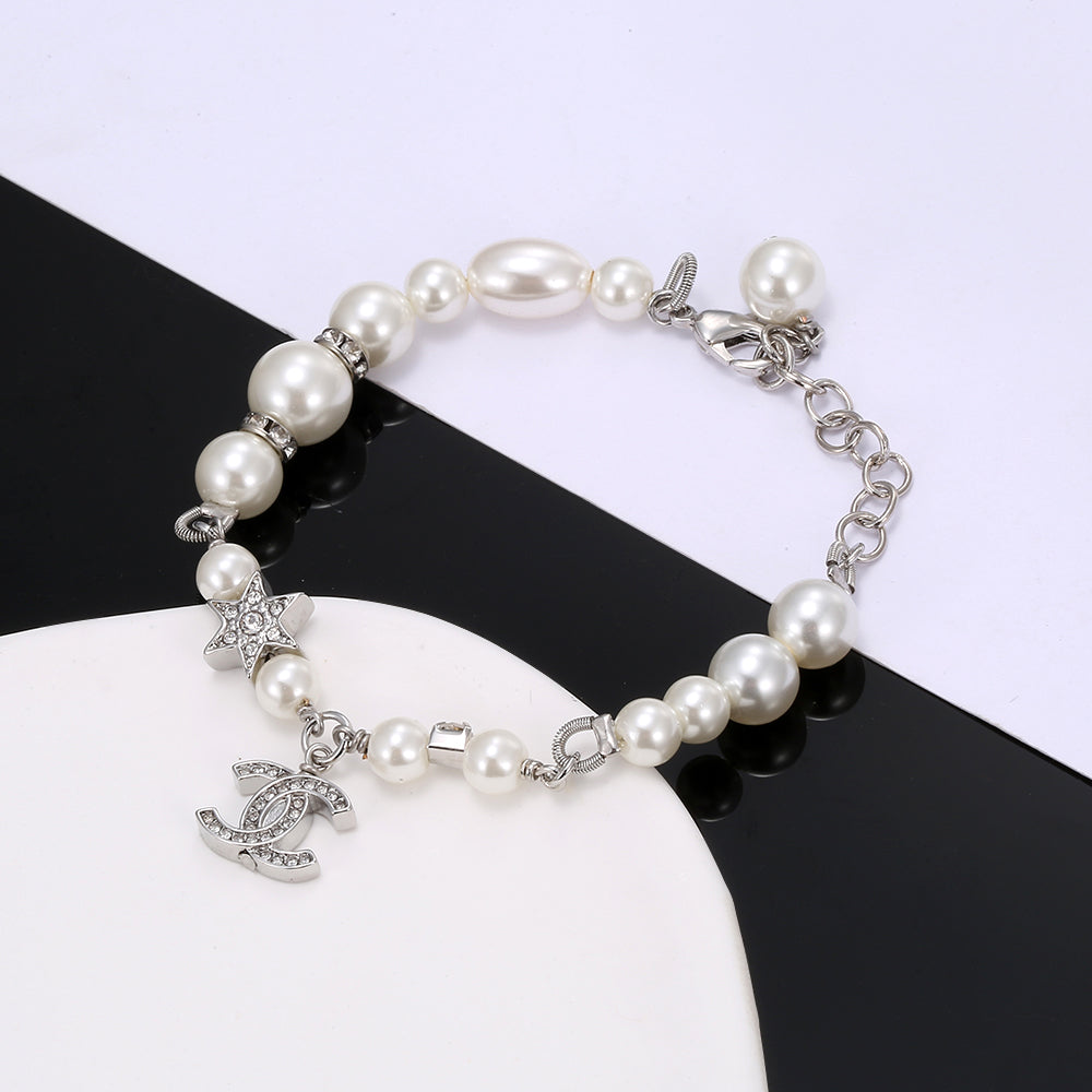 Bracelet chaîne en perles CC 18 carats