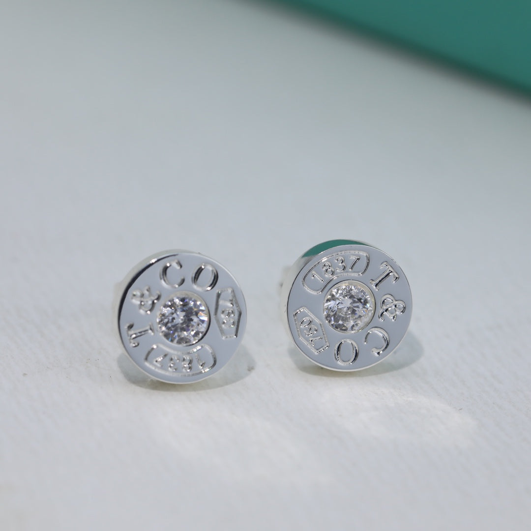 Boucles d'oreilles diamant 18 carats T 1837