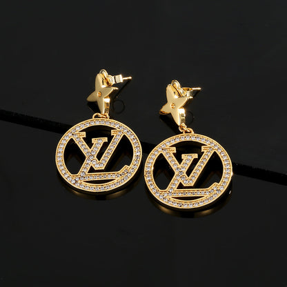 Boucles d'oreilles pendantes étoile Louis 18 carats