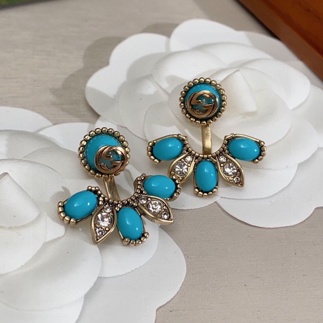 Boucles d'oreilles fleurs bleues Double G 18 carats