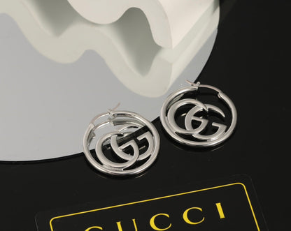 Boucles d'oreilles Double G 18 carats