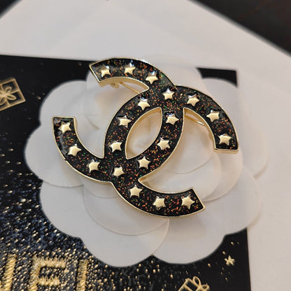 18K CC Black Star Brooch