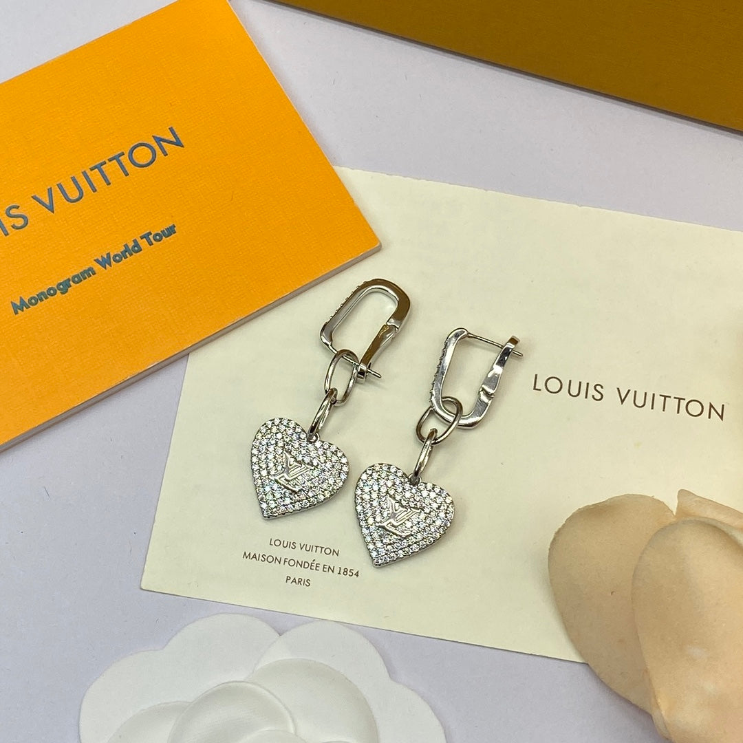 Boucles d'oreilles coeur en diamant Louis 18 carats