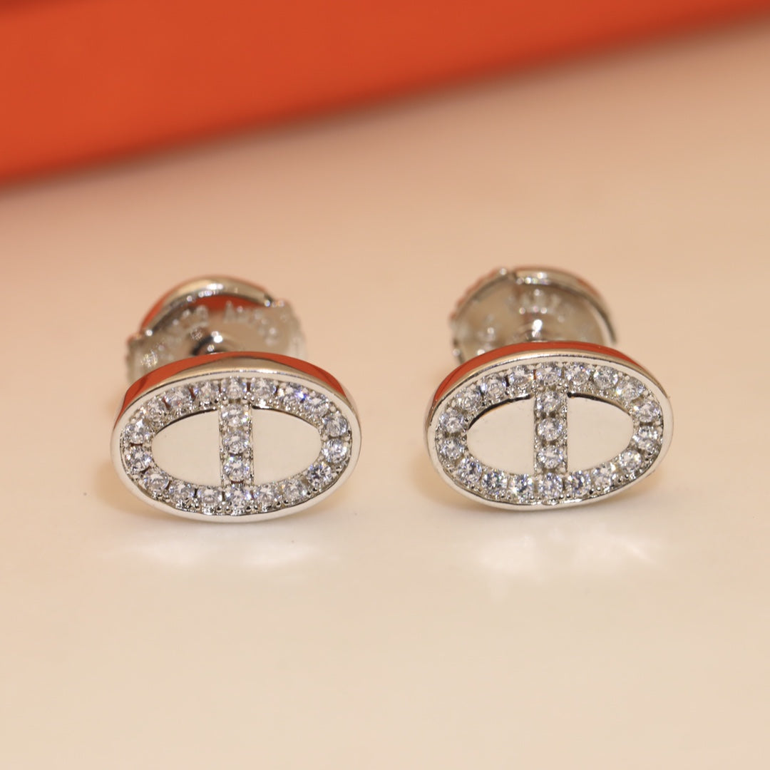 Boucles d'oreilles H en diamants mini farandole 18 carats