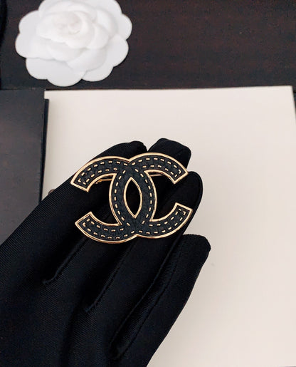 18K CC Black Brooch