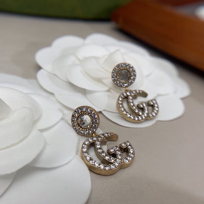 Boucles d'oreilles pendantes en cristal Double G 18 carats