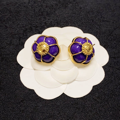 Boucles d'oreilles fleurs violettes 18 carats CC