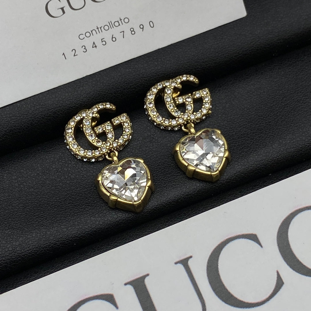 Boucles d'oreilles pendantes en cristal Double G 18 carats