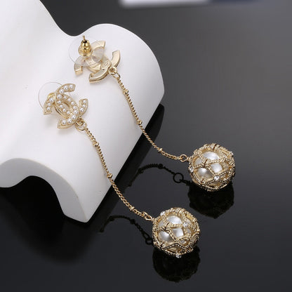 Boucles d'oreilles longues en perles CC 18 carats