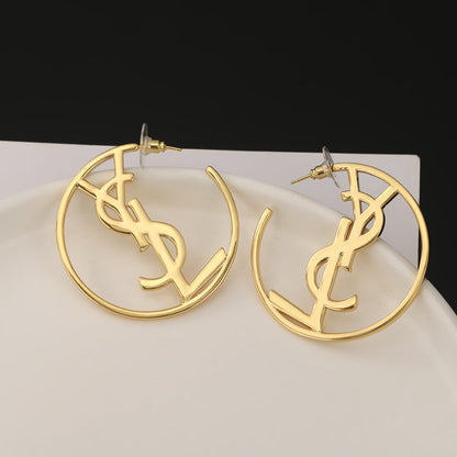 Boucles d'oreilles monogramme Sanit 18 carats