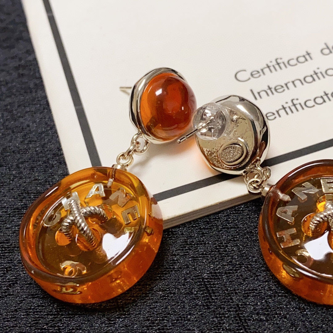 Boucles d'oreilles pendantes orange CC 18 carats