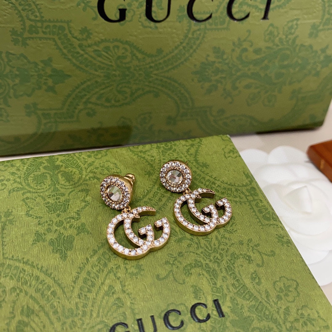 Boucles d'oreilles pendantes en cristal Double G 18 carats