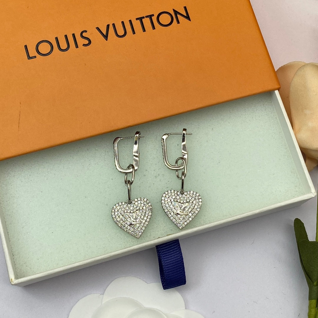 Boucles d'oreilles coeur en diamant Louis 18 carats