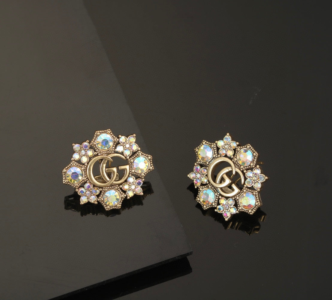 Boucles d'oreilles fleurs bleues Double G 18 carats