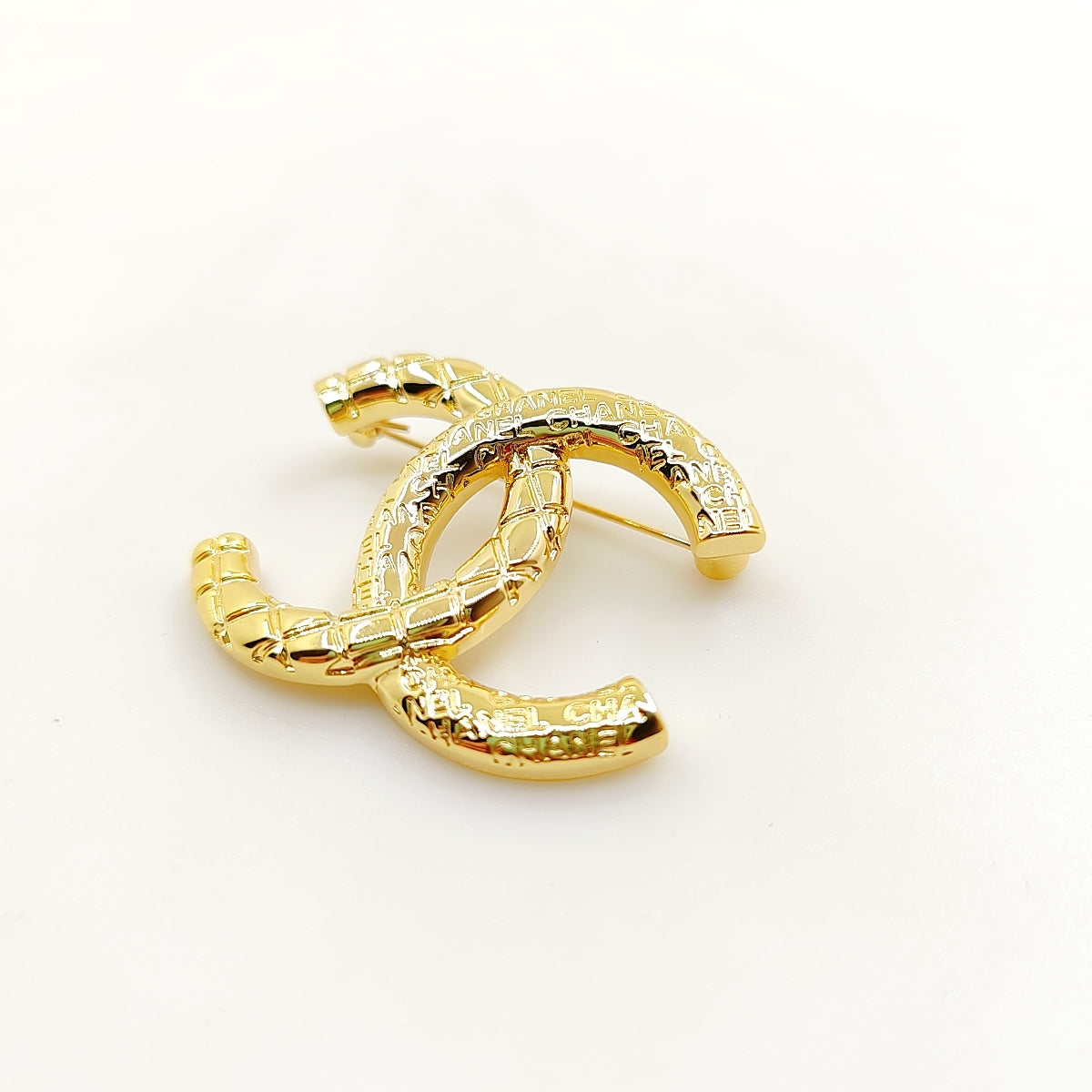 18K CC 24S Brooch