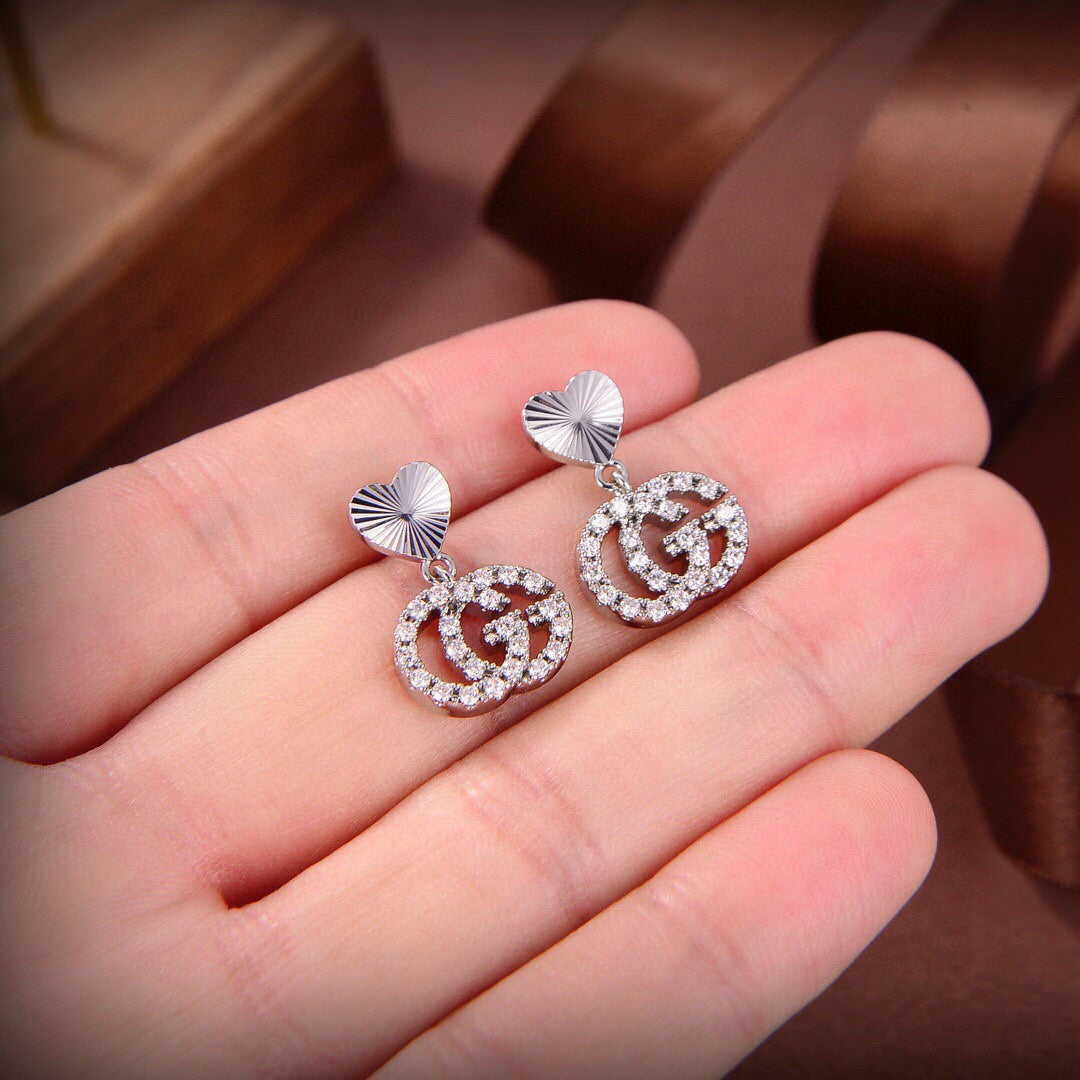 Boucles d'oreilles de course Double G 18 carats