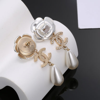 Boucles d'oreilles en perles de fleurs CC 18 carats