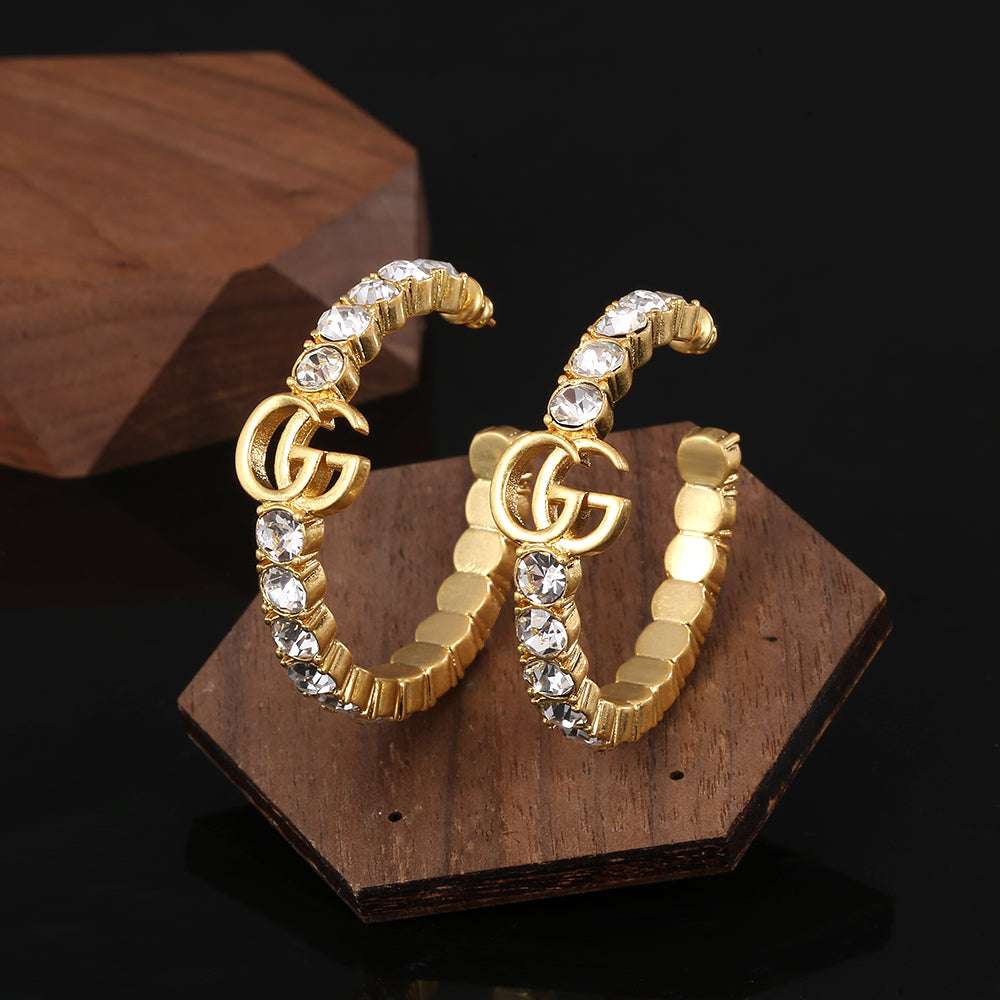 Boucles d'oreilles cercle double G 18 carats