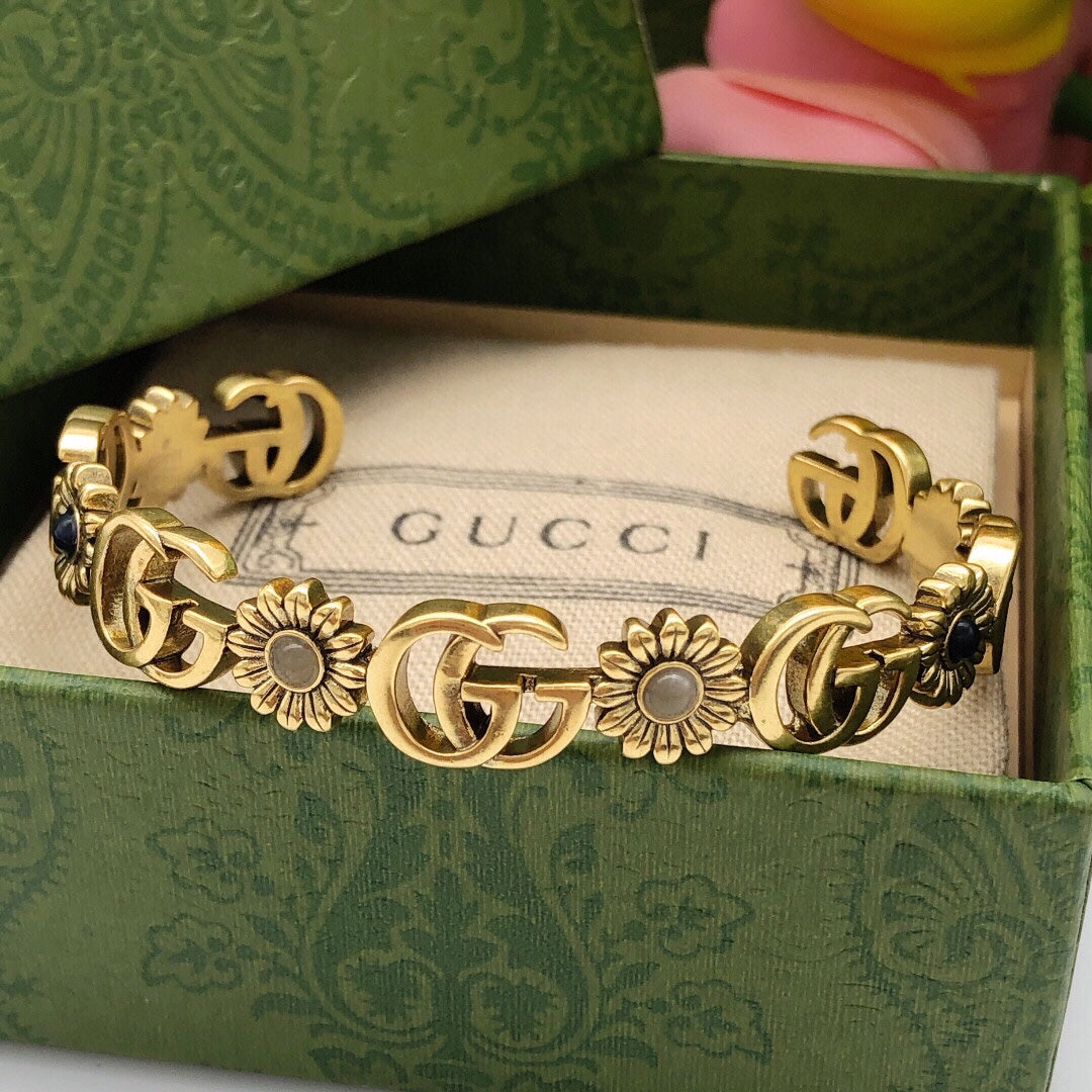 Bracelet manchette ouvert à fleurs Double G 18 carats