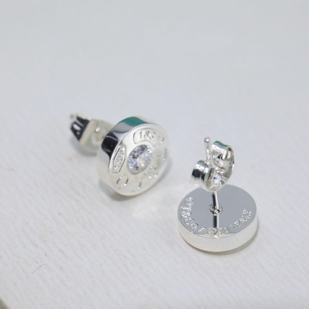 Boucles d'oreilles diamant 18 carats T 1837