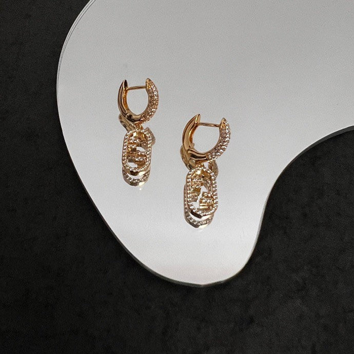 Boucles d'oreilles F O'Lock 18 carats