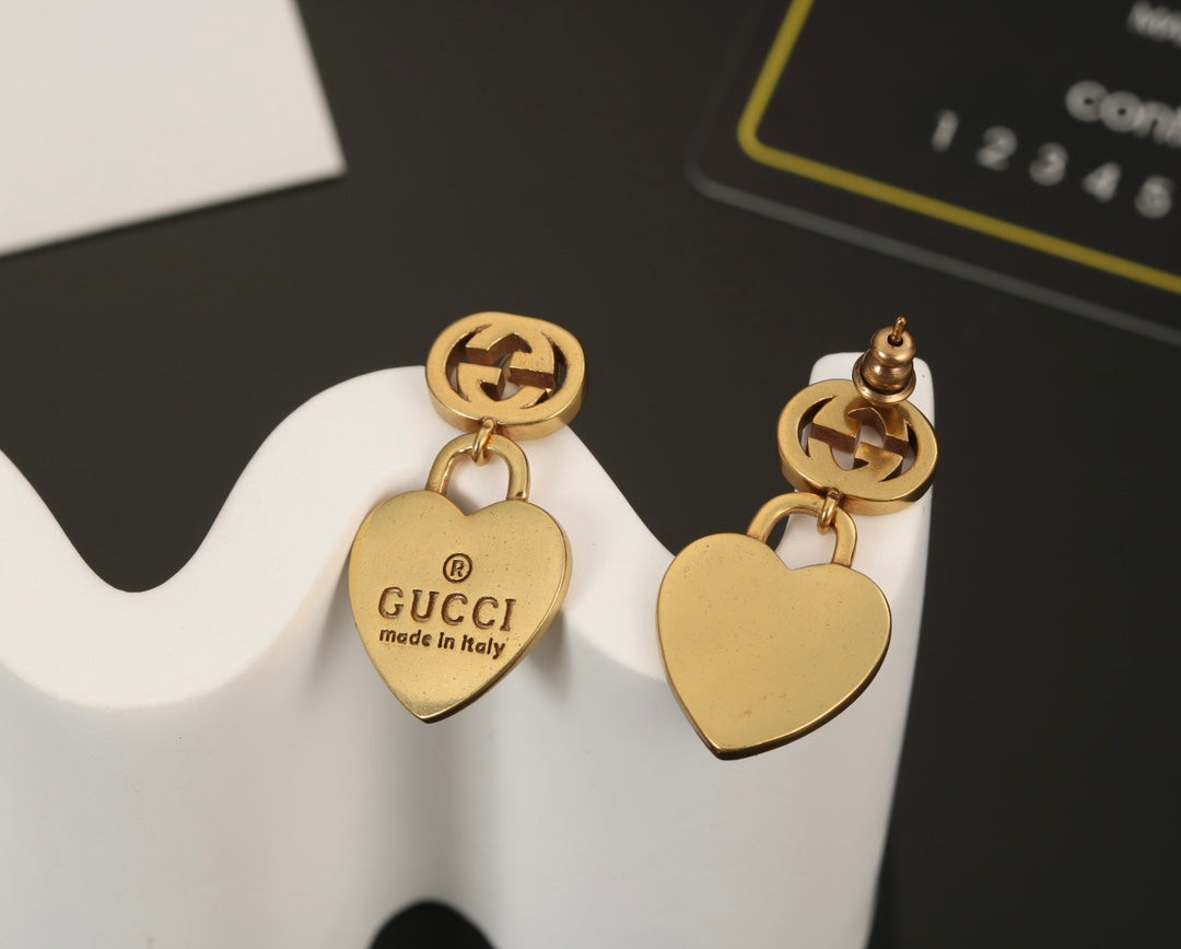 Boucles d'oreilles à pendentif cœur Double G 18 carats