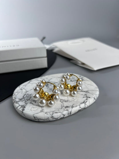 Boucles d'oreilles Triomphe à deux rangs de perles 18 carats