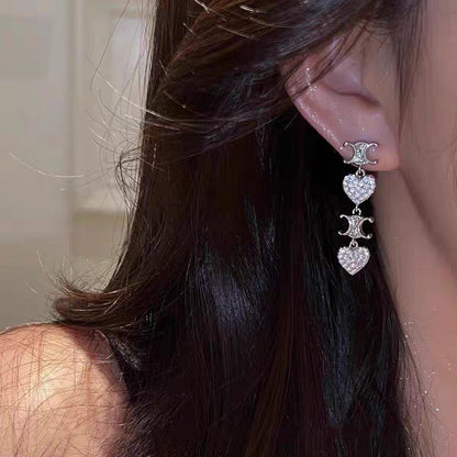 Boucles d'oreilles pendantes coeur Triomphe 18 carats