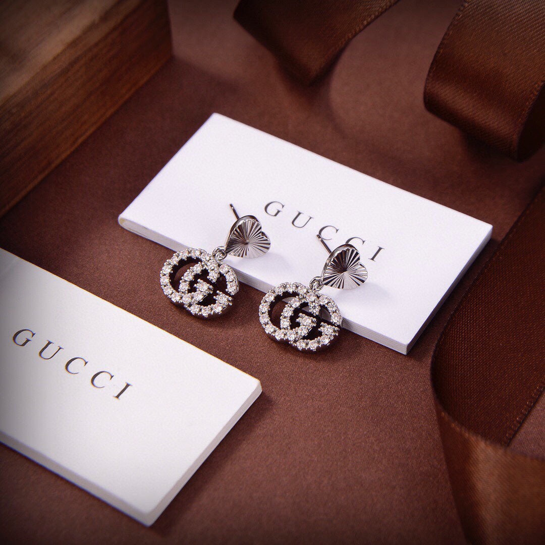 Boucles d'oreilles de course Double G 18 carats