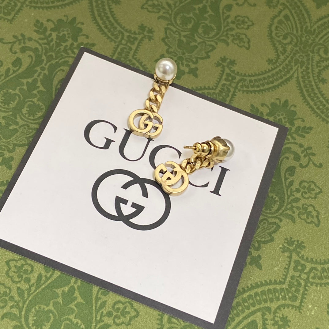 Boucles d'oreilles chaîne double G 18 carats