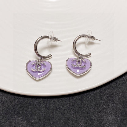 Boucles d'oreilles coeur violet 18 carats CC