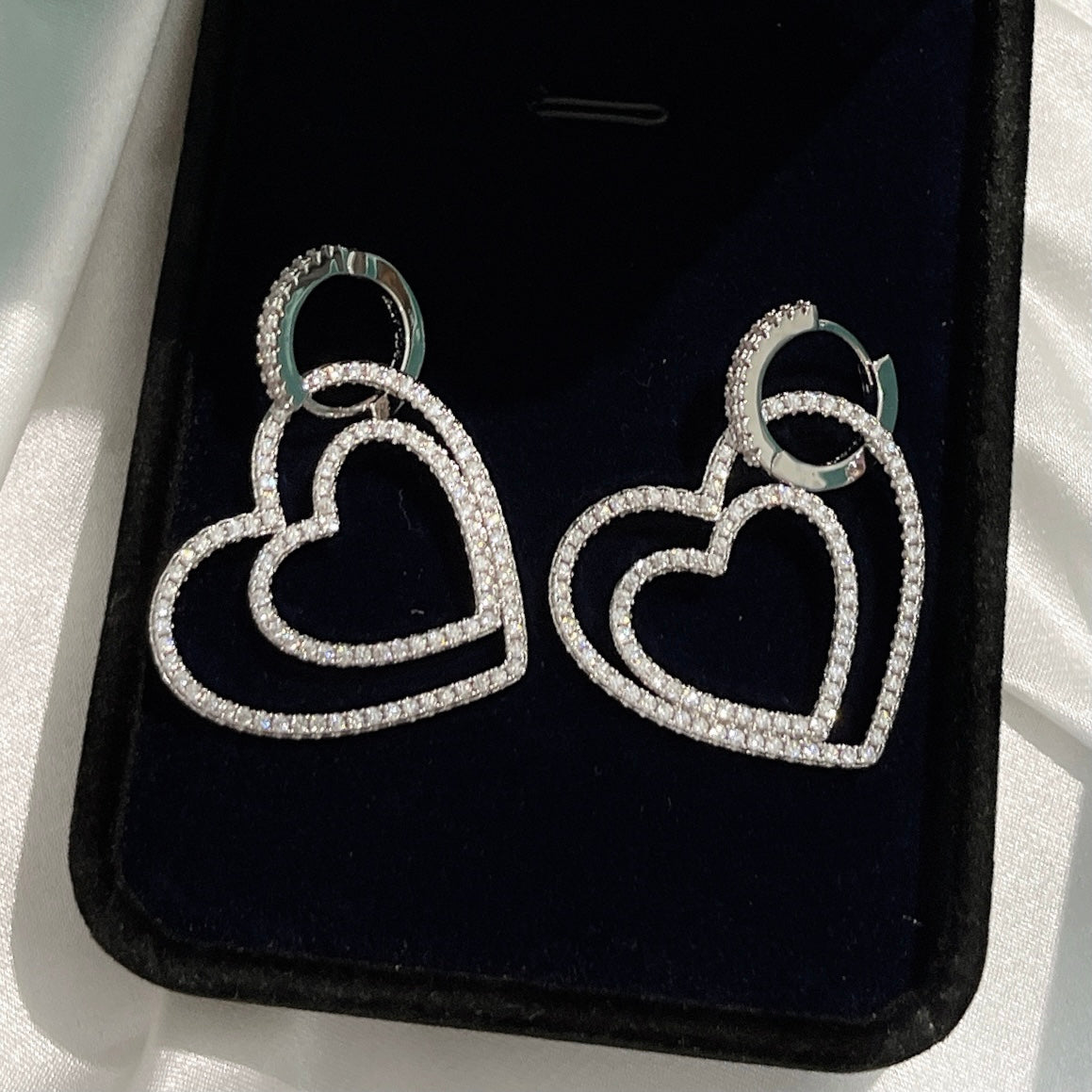 Boucles d'oreilles diamant double cœur 18 carats T